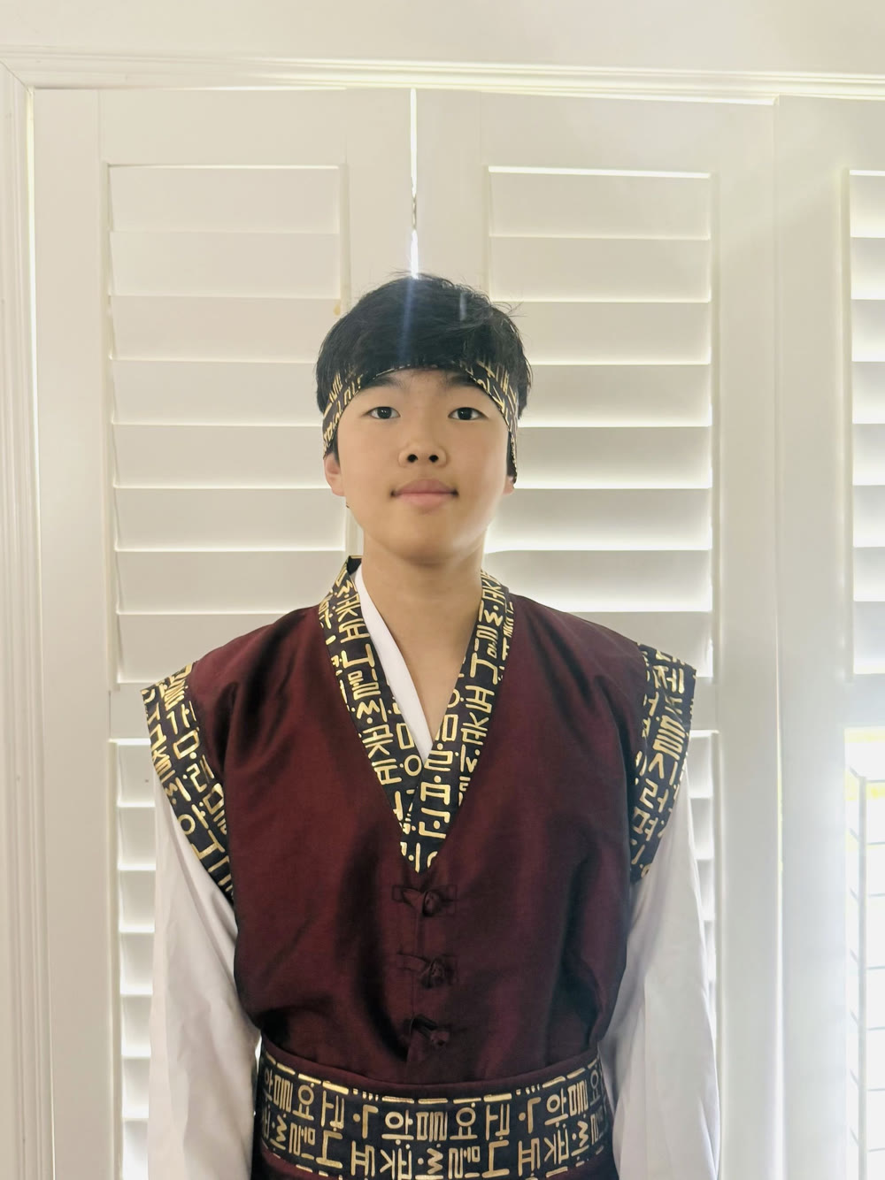 Louis Seo wearing a traditional Korean performance uniform